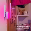 Lampa lampka nocna zmieniająca kolory RGB 7 LED Bonaura widok na ścianie w kolorze różowym