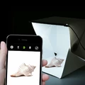 Mini studio fotograficzne z oświetleniem 4W widok z telefonem